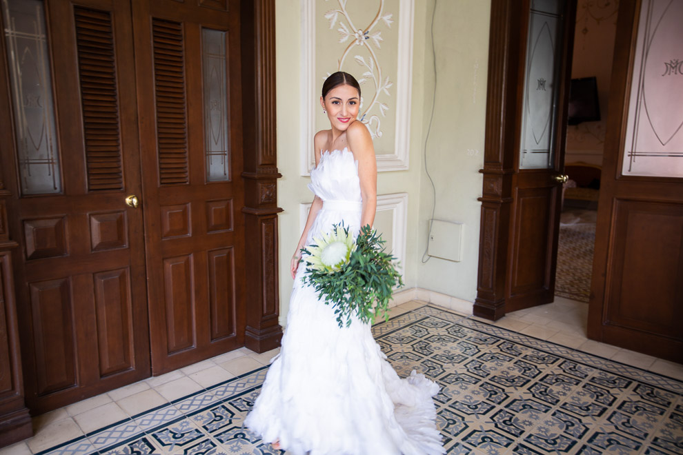 stylish merida mexico bride with protea boquet and feathered wedding gown elizabeth medina yucatan wedding blog 0028 Casa Faller and Mansion Merida, Wedding Day Photos in Merida’s Most Elegant Wedding Venues, Maribel and Robertostylish merida mexico bride with protea boquet and unique wedding gown  