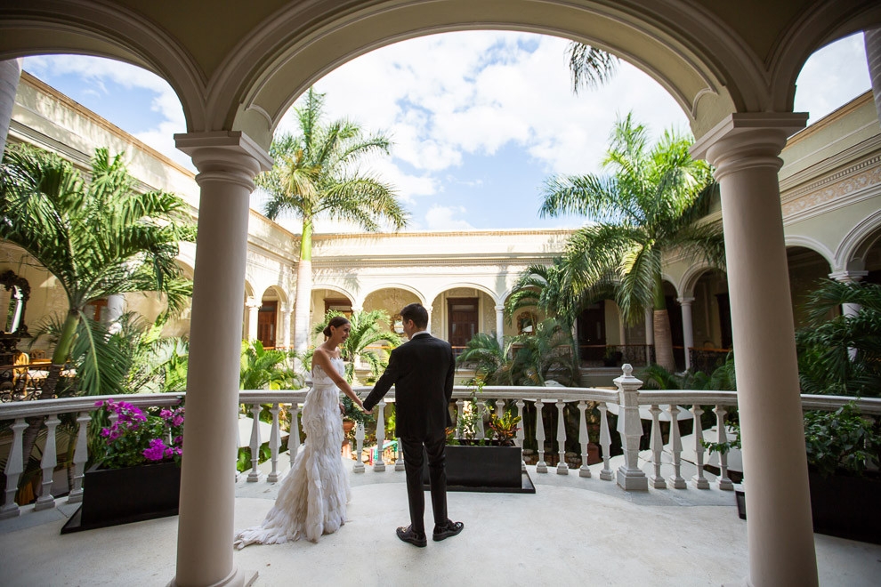 couple holding hands under arches, first look in historic merida centro home elizabeth medina yucatan wedding blog 0033 Casa Faller and Mansion Merida, Wedding Day Photos in Merida’s Most Elegant Wedding Venues, Maribel and Roberto first look in historic merida centro home  