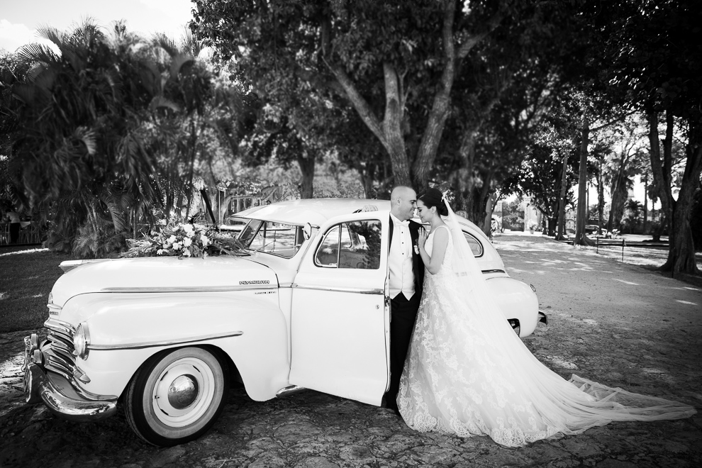 bride and groom with vintage car black and white photo 917_528 A very international wedding in Merida, Mexico  